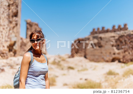 Young woman visiting a restored medieval castle. Young woman visiting a restored medieval castle. 81236754