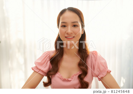Head shot close up beautiful smiling young woman looking at camera 81245648