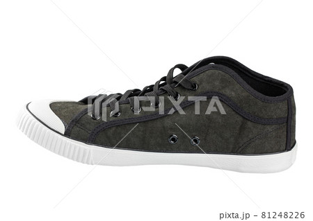Black gumshoe isolated on white background. Stylish youth shoes. 81248226
