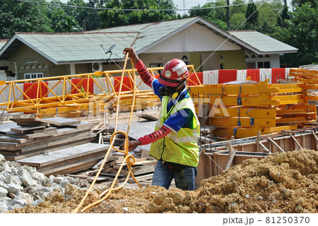 JOHOR, MALAYSIA -MARCH 29, 2016: Construction workers spraying the anti termite chemical treatment to the soil at the construction site.  81250370