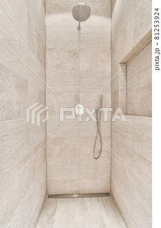 Modern shower stall in a bright bathroom Modern shower stall in a bright bathroom 81253924