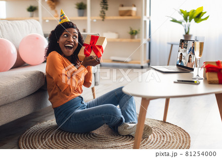 Black Woman Receiving Gift Having Online Birthday Party At Home 81254000