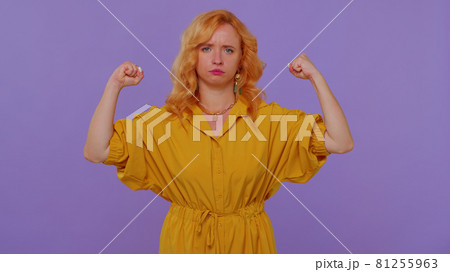 Girl showing biceps, feeling power strength to fight for rights, energy to gain success win fight 81255963