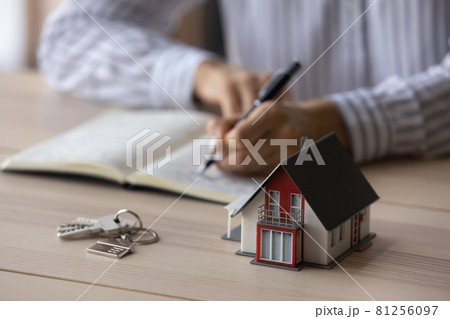 Close up of house maquette and keys on realtor table Close up of house maquette and keys on realtor table 81256097