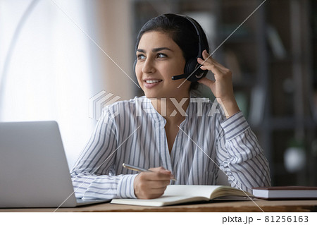 Indian female in earphones study online on laptop Indian female in earphones study online on laptop 81256163