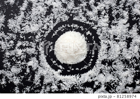 White salt on dark background. 81258974