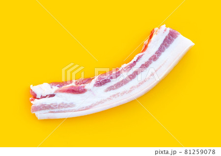Streaky pork on yellow background. 81259078