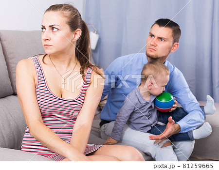 gloomy man and woman with crying son quarreled 81259665