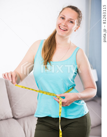 Woman happy to lose weight 81263115