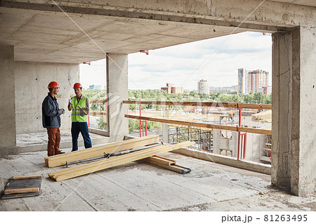 Workers at Construction Site Wide Angle 81263495