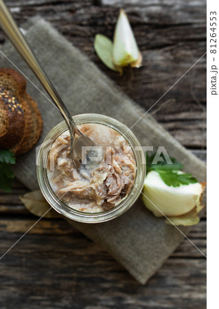 Stew in a glass jar, herbs and vegetables, bread on a wooden table. Preservation and storage of products. Stew in a glass jar, herbs and vegetables, bread on a wooden table. Preservation and storage of products. 81264553