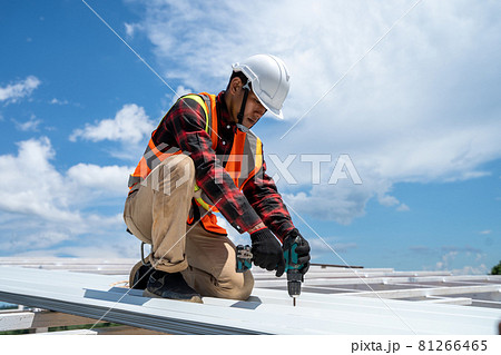 Roofing,Construction workers wearing safety harness checking and installation assembly of new roof. 81266465