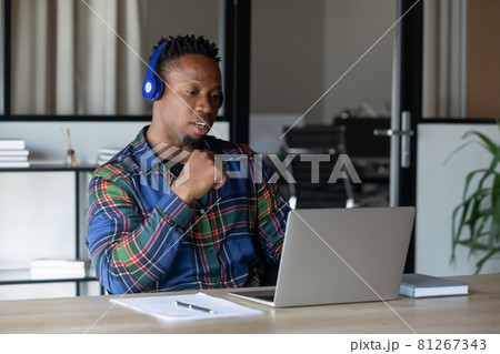 Young African American male employee talk on webcam call Young African American male employee talk on webcam call 81267343