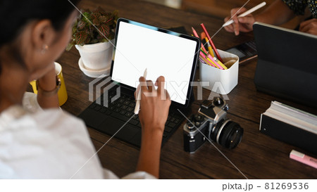 Cropped shot of photographer and creative designer working together with digital tablet. 81269536