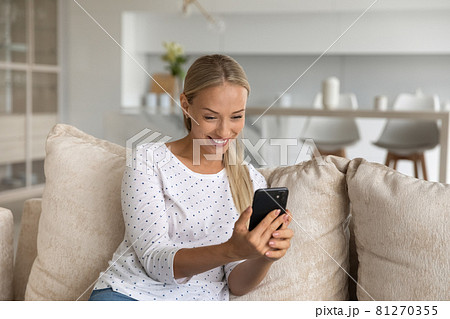 Happy excited millennial woman having nice video call talk 81270355