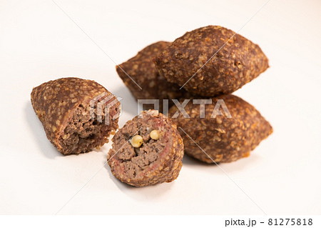 Traditional kebbe and pita bread on big round plate in lebanese restaurant Traditional kebbe and pita bread on big round plate in lebanese restaurant 81275818
