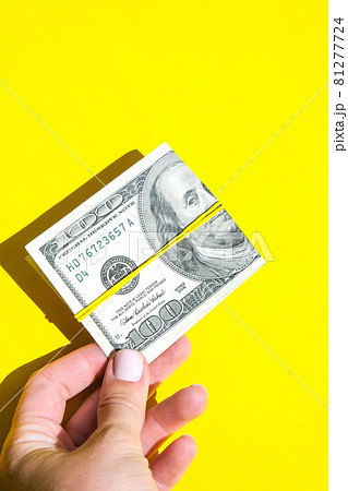 Female hand holding dollars close up. Money currency. Online shopping. Giving money. Business budget of wealth and prosperity finance, buy coin. Salary investment savings 81277724