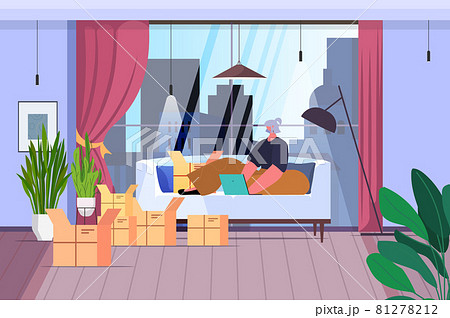 senior woman using laptop and opening cardboard parcel boxes unboxing mail delivery ordering online via internet 81278212