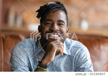 Head shot portrait of happy Black mixed race hipster guy 81280807