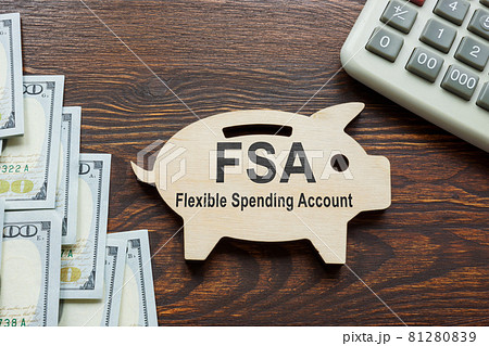 FSA flexible spending account words on the wooden piggy bank. 81280839