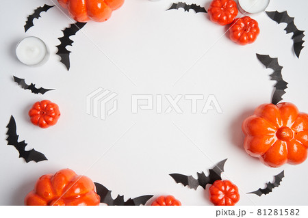 Halloween background, orange decorative plastic pumpkin black paper bat white cardboard Thanksgiving greeting card 81281582
