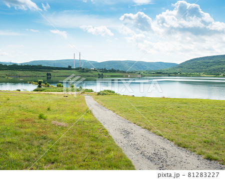 Milada lake, high chimneys of heating plant in Usti nad Labem city. Milada lake, high chimneys of heating plant in Usti nad Labem city. 81283227