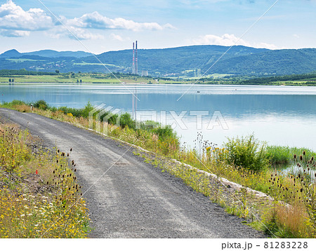 Milada lake, high chimneys of heating plant in Usti nad Labem city. Milada lake, high chimneys of heating plant in Usti nad Labem city. 81283228