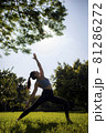 Lady fitness trainer stretching outdoors. 81286272