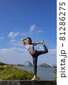 Lady fitness trainer stretching outdoors. 81286275