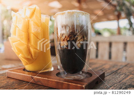 Iced latte coffee and mango juice drinks in concept of summer. 81290249