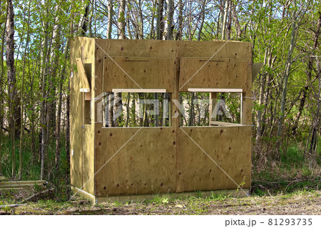 A hunting blind being assembled 81293735