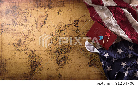 Happy Columbus Day concept. Vintage American flag, compass, paper boat, rope on retro treasure manuscript. Flat lay, top view with copy space. Happy Columbus Day concept. Vintage American flag, compass, paper boat, rope on retro treasure manuscript. Flat lay, top view with copy space. 81294706