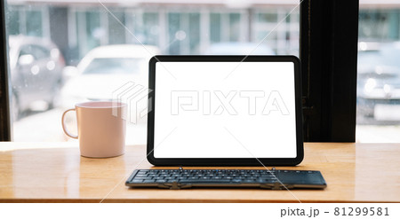 Shot of digital tablet with blank white screen, keyboard, cup of coffee on workspace desk Shot of digital tablet with blank white screen, keyboard, cup of coffee on workspace desk 81299581