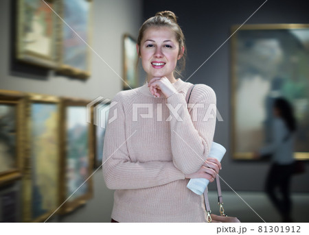 Portrait of laughing woman looking at pictures Portrait of laughing woman looking at pictures 81301912