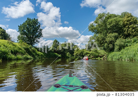 Canoeing on a quiet river. Journey in kayaks on the river. Active rest on the water. Canoeing on a quiet river. Journey in kayaks on the river. Active rest on the water. 81304035