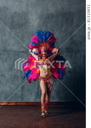Woman in brazilian samba carnival costume with colorful feathers plumage 81310651