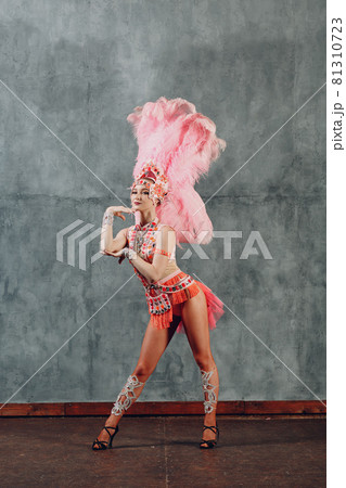 Woman in samba or lambada costume with pink feathers plumage 81310723