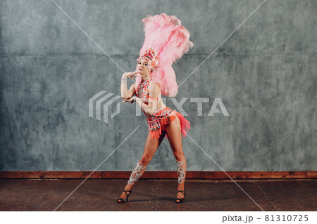 Woman in samba or lambada costume with pink feathers plumage 81310725