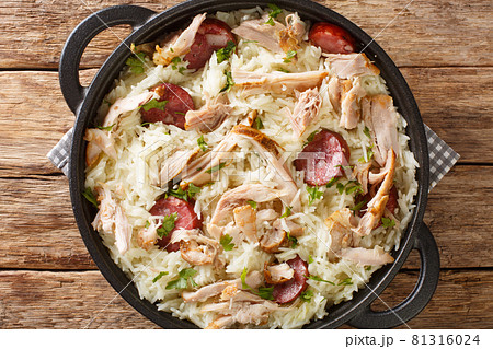 Chicken bog is a delicious chicken, rice and sausage dish closeup in the pan. Horizontal top view 81316024