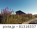 BULGARIA, PIRIN NATIONAL PARK, BANSKO, SEPTEMBER 7, 2020: Landscape view of Bezbog hut and beautiful pink alpine flowers in National park Pirin Focus on the building 81316337