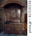 A place to place candles lit by believers in a temple 81316338
