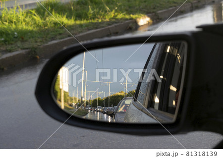 Looking in the side rear-view mirror in the day of rainy dreams Looking in the side rear-view mirror in the day of rainy dreams 81318139