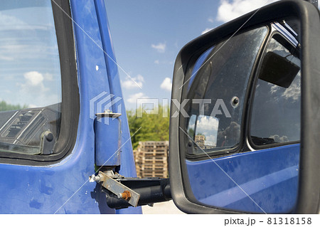Retro side rear-view mirror on the road in the factory Retro side rear-view mirror on the road in the factory 81318158