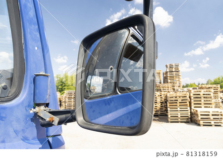 Retro side rear-view mirror on the road in the factory 81318159