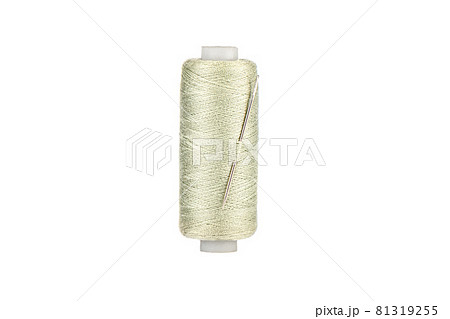 Needle in spool of thread in Tahuna Sands color isolated on white background. Copy space. 81319255