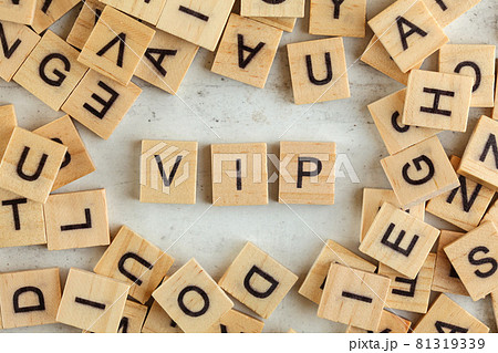 Top down view, pile of square wooden blocks with letters VIP (stands for Very important person) on white board. Top down view, pile of square wooden blocks with letters VIP (stands for Very important person) on white board. 81319339