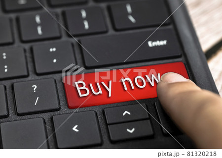 Closeup of finger on red computer keyboard key with the text Buy now in white Letters, Online shopping, technology and sale concept 81320218