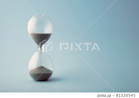 Hourglass time clock in blue tone 81320545