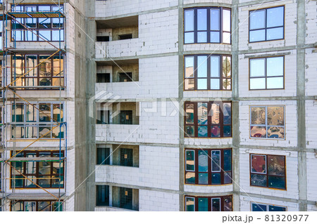 Aerial view of high residential apartment building under construction. Real estate development. Aerial view of high residential apartment building under construction. Real estate development. 81320977