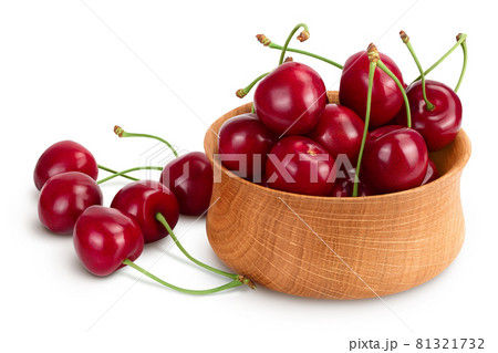 red sweet cherry in wooden bowl isolated on white background with clipping path and full depth of field 81321732